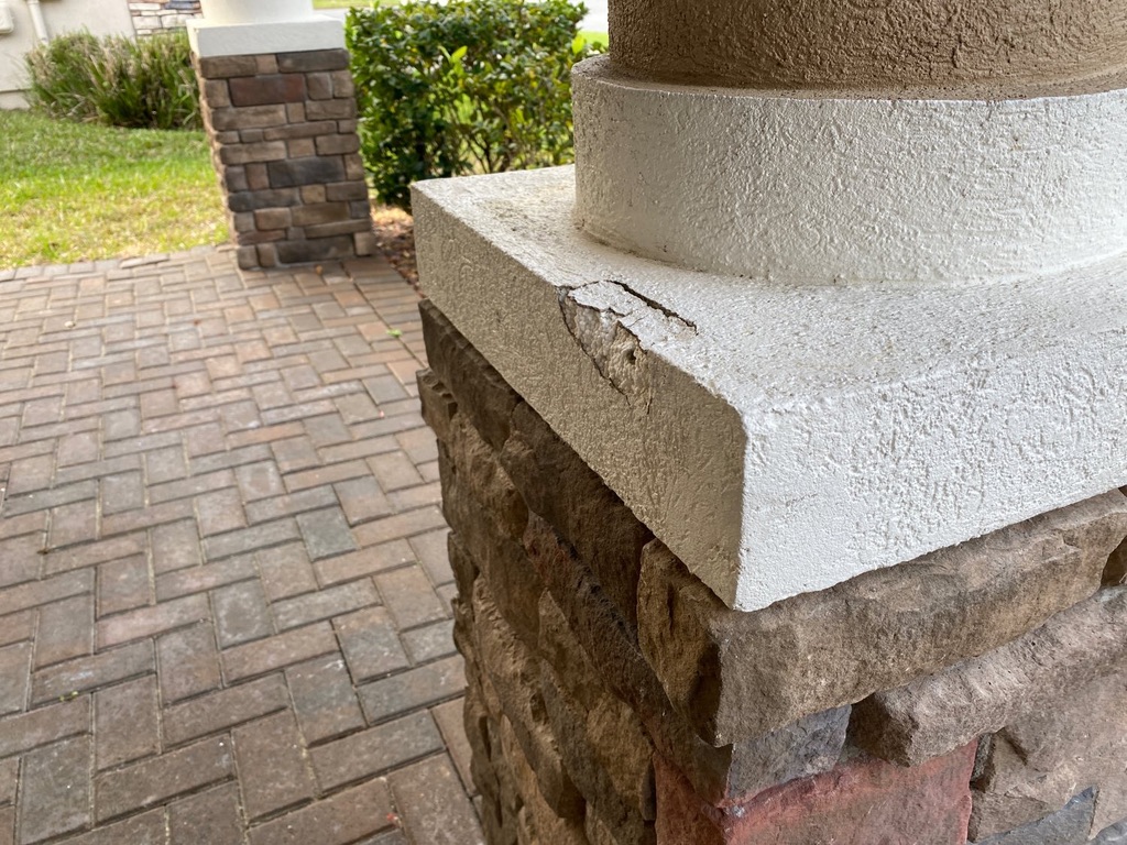 Inspector evaluating the exterior of a Northeast Florida home during a buyer inspection